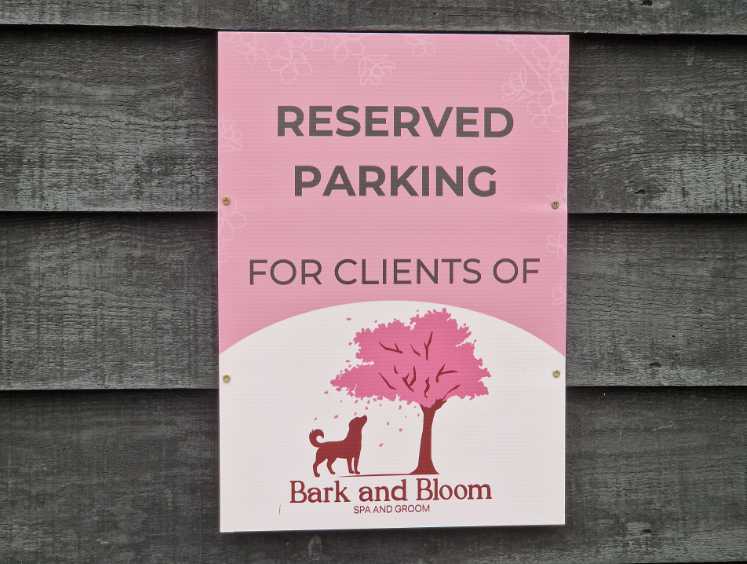 Bark & Bloom reserved parking sign